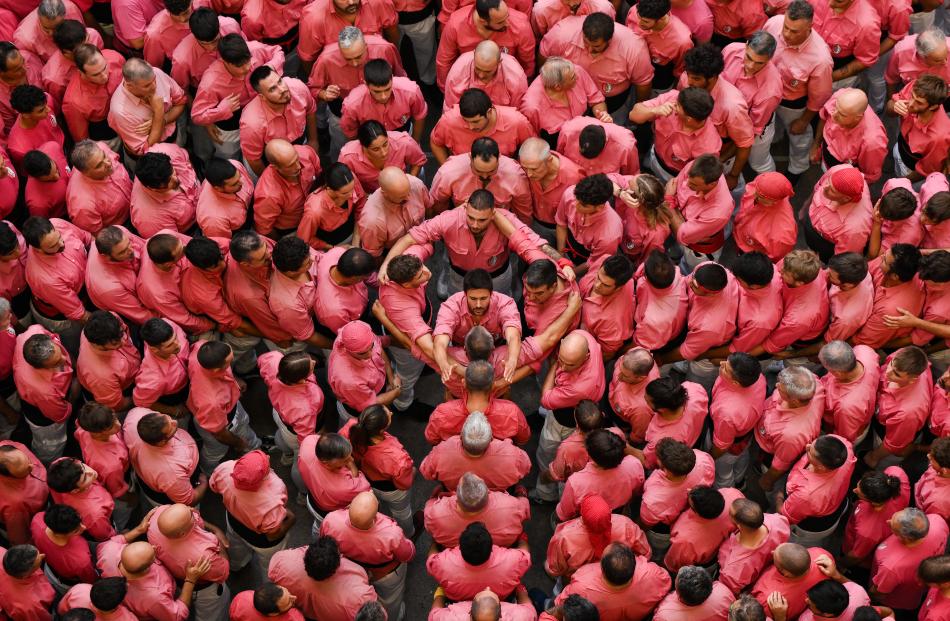 Members of the Colla Vella dels Xiquets de Valls build a human tower during the 29th "Castells"...