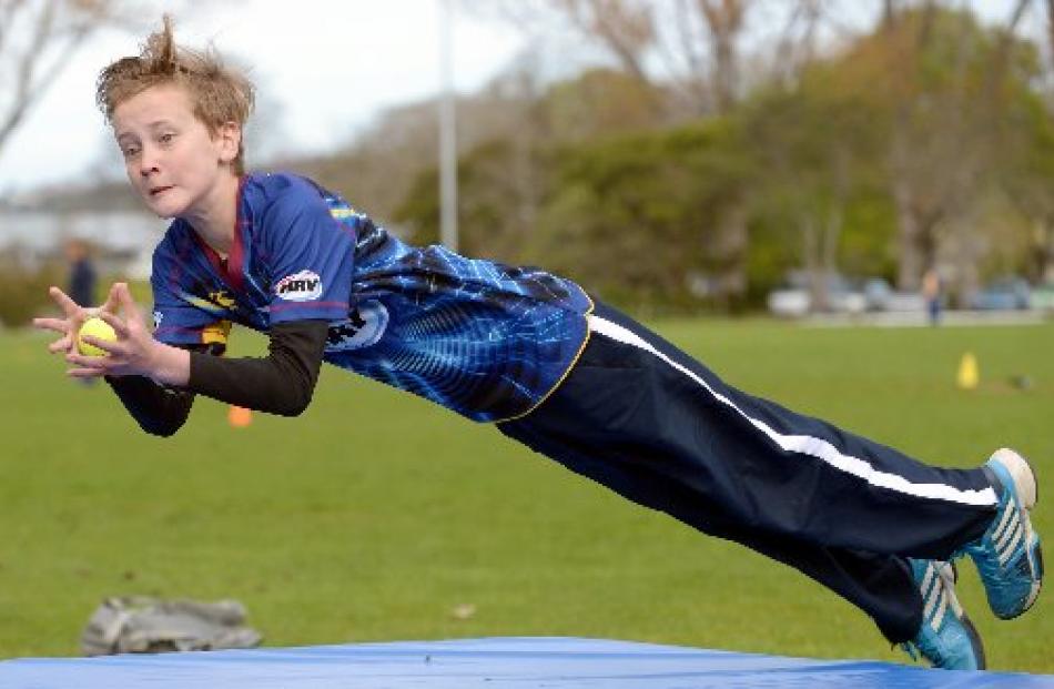 Tom Procter (10) of Elmgrove School takes a catch during a Junior Volts ...day at Logan Park...