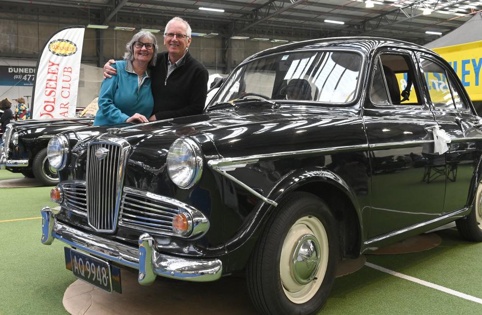 Christchurch couple Colin and Jenny Hey stand with the 1964 Wolseley 1500 Mk 3 used on their...