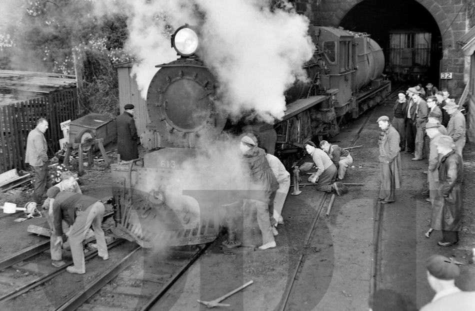 Evening Star, 1960. This 78 tonne locomotive is gradually lifted back onto the rails by means of...