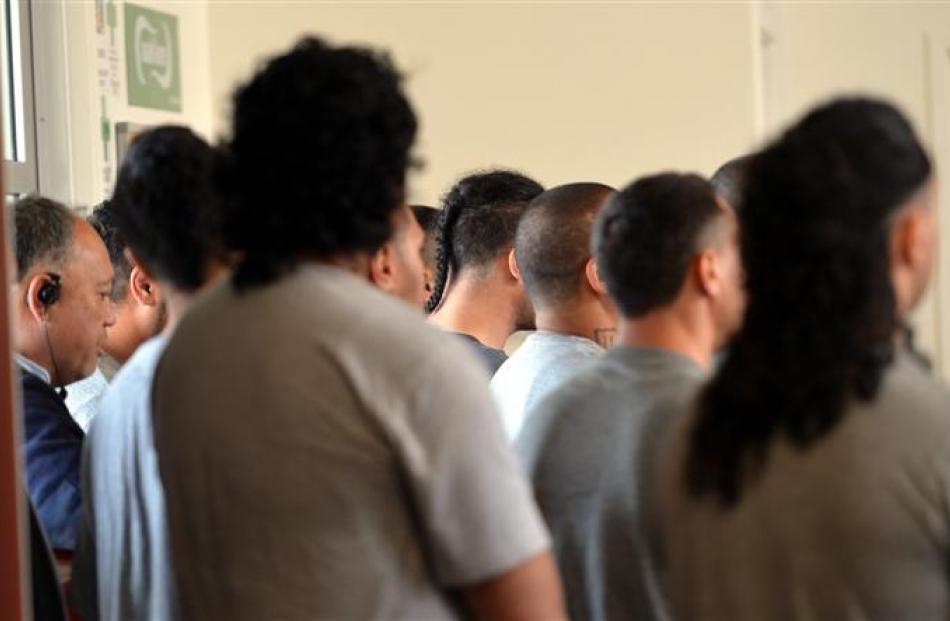 High security prisoners listen to a guest speaker.
