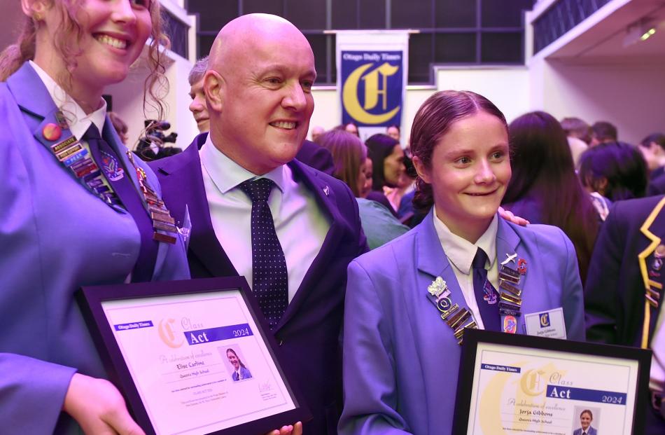 Christopher Luxton with Queens High School pupils Elise Carline (left) and Jorja Gibbons. PHOTO:...