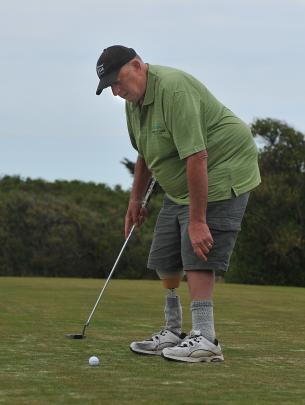 Alan Dearden putting on the ninth hole.