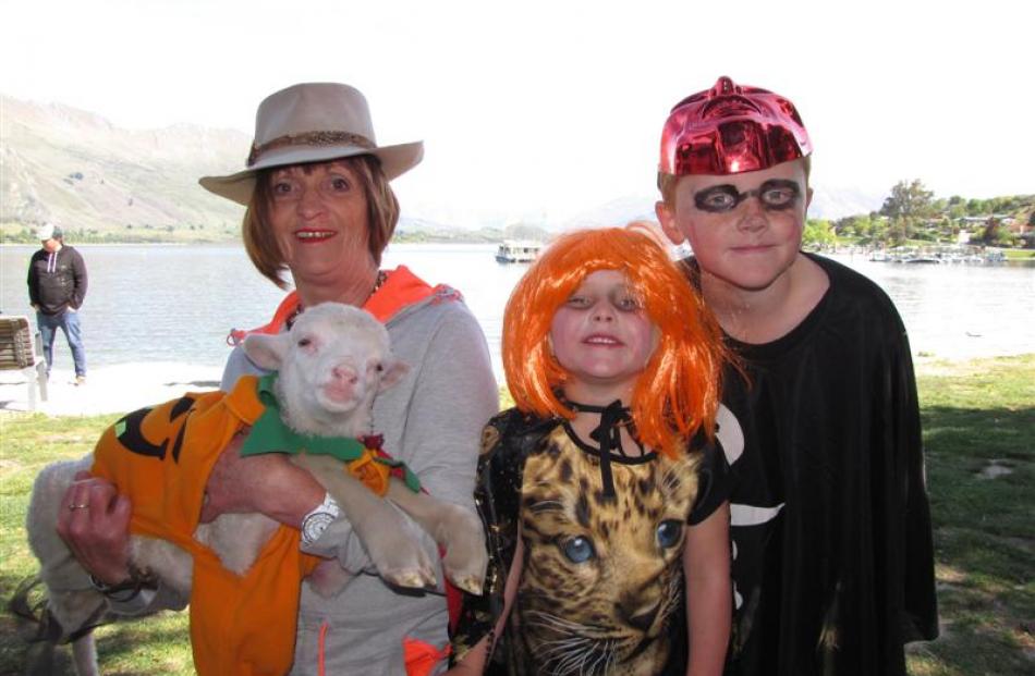 Bev Mair, of Lake Hawea, with Hugo the lamb and 4-year-old grandchildren Mikayla and Jackson...