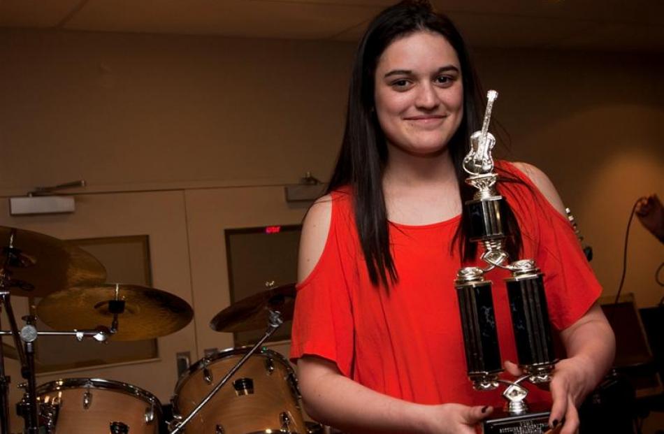 Renee O'Brien, of Mosgiel, with her trophy for the best intermediate performer.