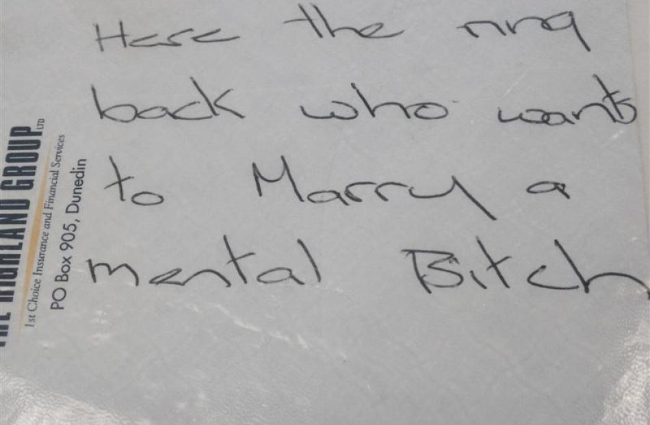Her handwriting on an envelope dated  September 26, 2002.