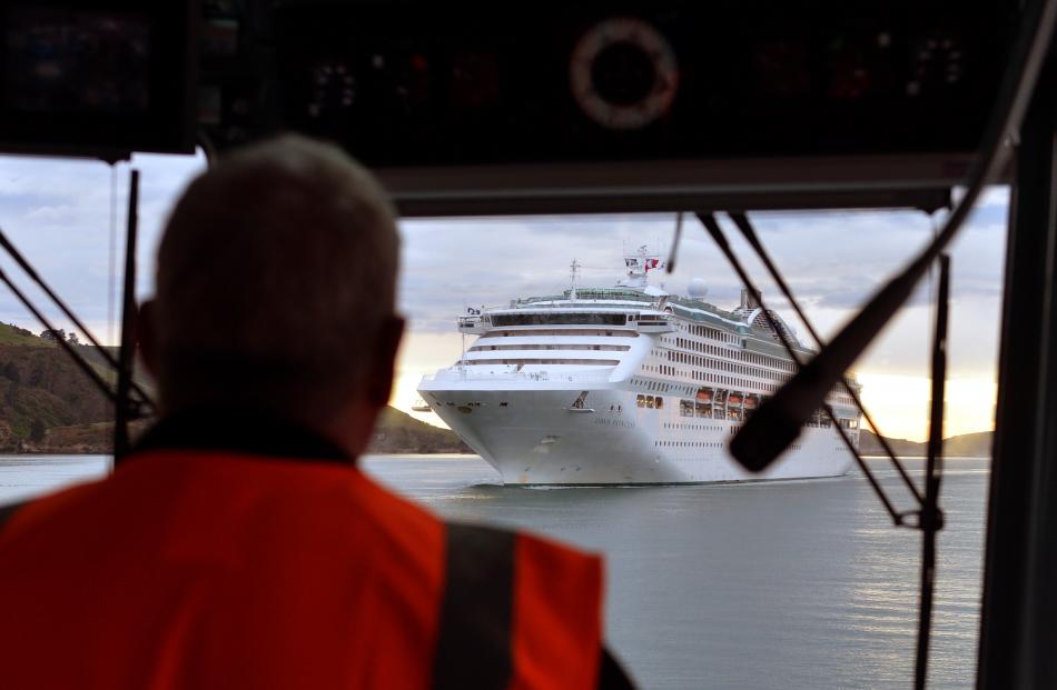 Port Otago chief pilot Hugh Marshall concentrates on his second task for the morning, the cruise...