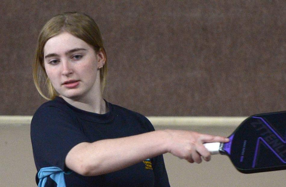 Carli Hutchison, 14, from Cromwell College, learns about the growing sport of pickleball.