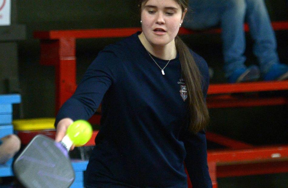 Holly Cairns, 14, from Trinity College, has a go at pickleball.