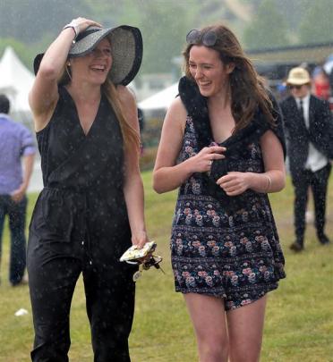 Kate Holden (18) and Harriet Keown (17) brave the rain at Wingatui.