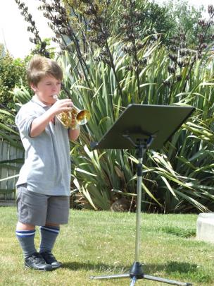 Mount Aspiring College pupil Hamish McLean (14) plays the Last Post in Wanaka.