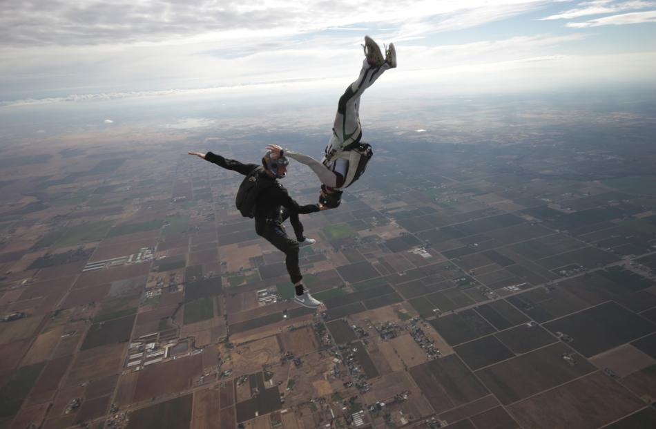 Blair Hamelink (left) and wife Kelly during a skydiving training jump in California. Photo supplied