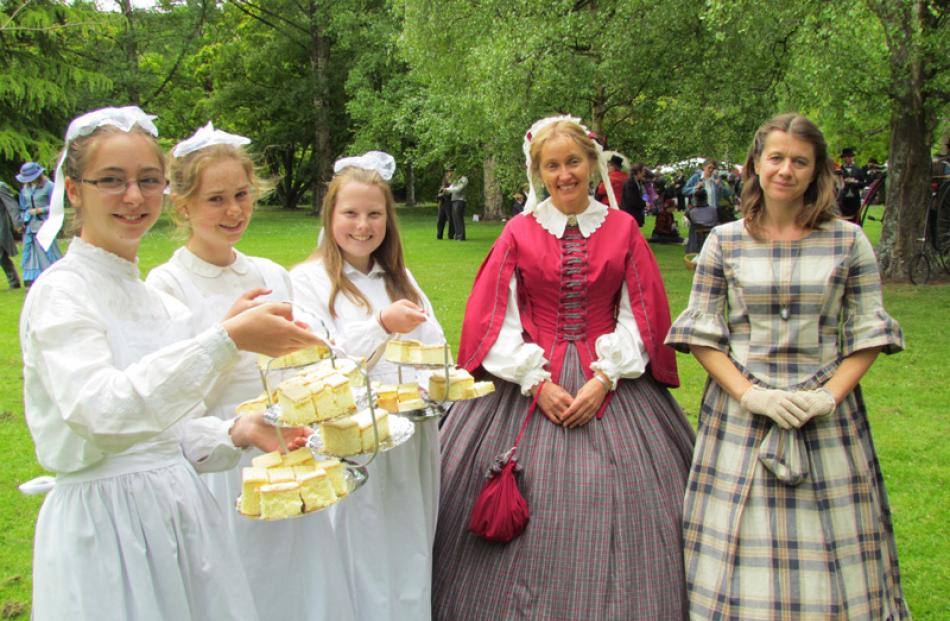 Oamaru ''maids'' (from left) Bronwen Ardouin (14), Sally Lory (14) and Lauryn Stewart (13) serve...