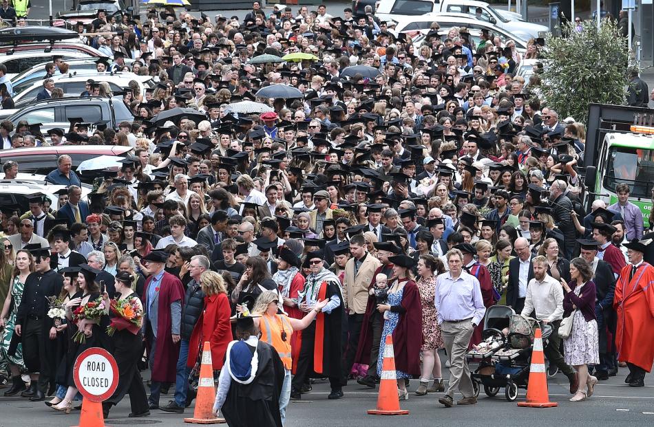Graduands swarm through central Dunedin during yesterday’s University of Otago graduation parade.