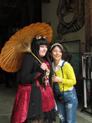 Alice Liddell (left), from Dunedin, in her Steampunk character Lady Lusca, poses with Japanese...
