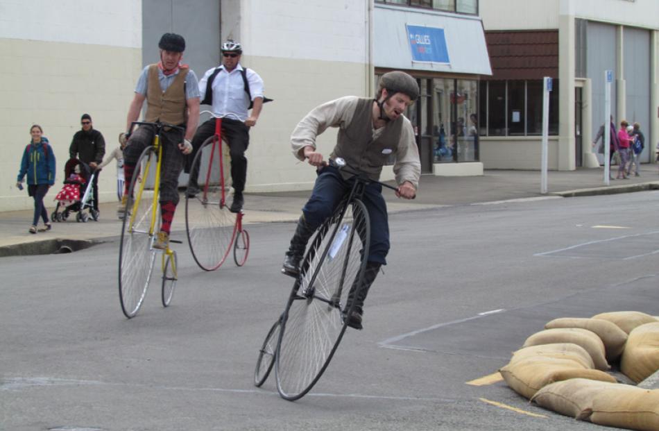 Oliver Briggs, from Oamaru, leads two Christchurch penny farthing riders John Davey (second) and...