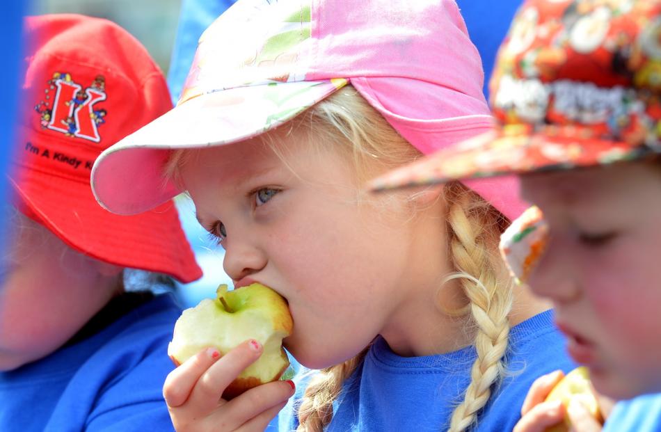 Mackenzie Porter (4), of Roslyn Kindergarten, eats a healthy snack