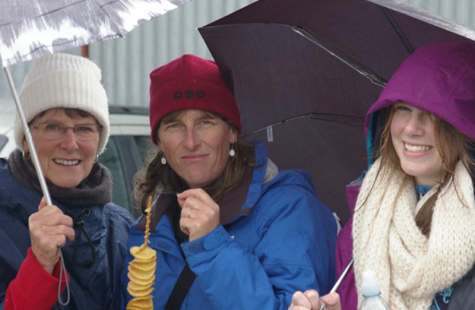 What rain? ... Margaret Johanson, Sonia Richardson and Grace Richardson, all from Heriot, enjoy...