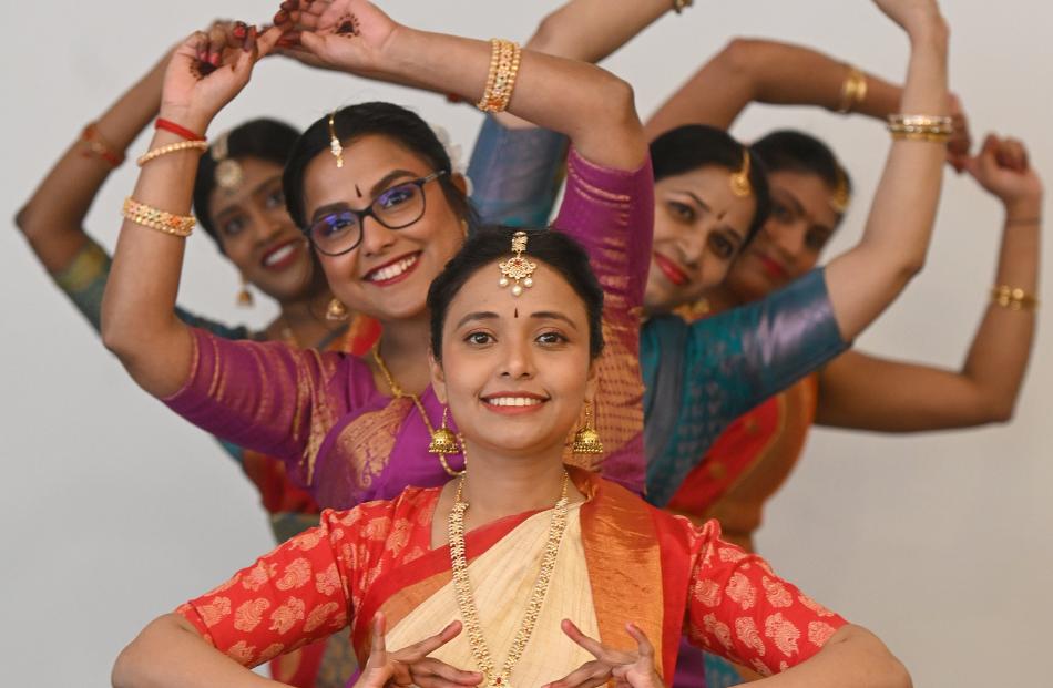 Celebrating India's independence day dressed in traditional costumes are dancers Thiloma Liyanage...