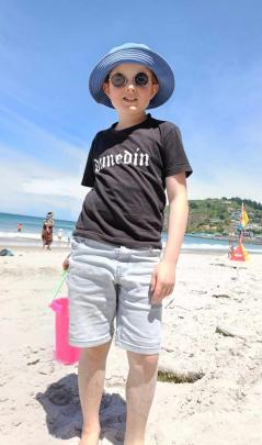 Enjoying some sunshine ... Fraser Malcolm-Swindells, 8, on St Clair Beach on December 30. PHOTO:...