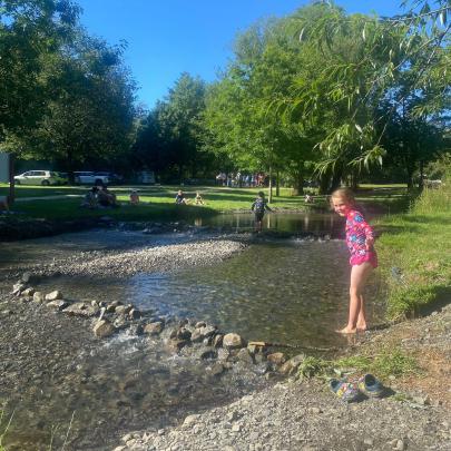 Dam fun ... Harriet Laing, 7, spent a lovely afternoon building a dam with her brother at the...