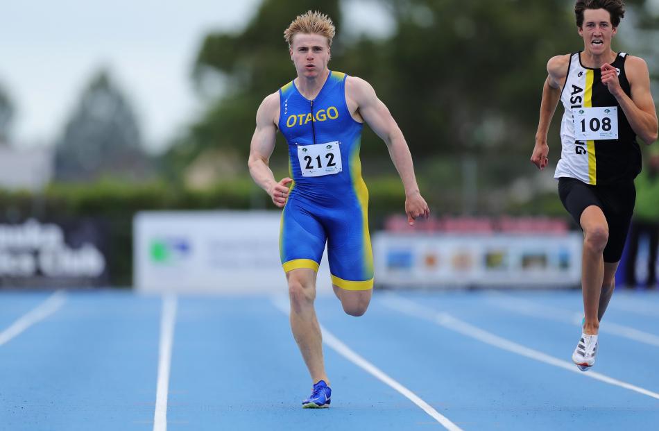 Otago’s John Gerber darts towards the finish line in the men’s 200m. PHOTOS: JOHN CASWELL /...