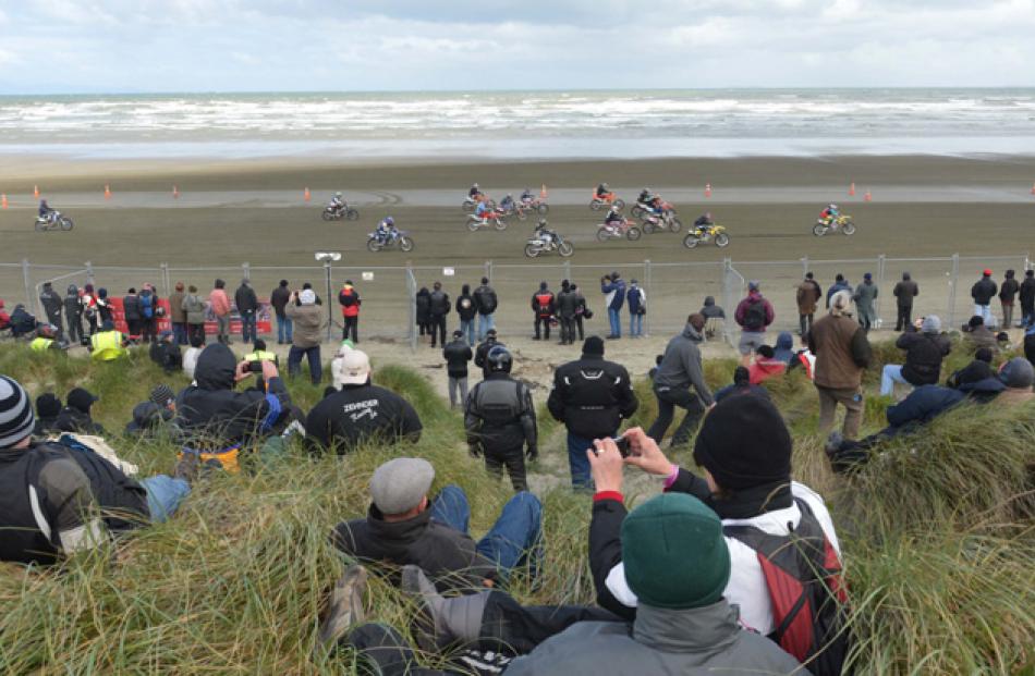 Crowds watch the start of the eight-lap overall open class  event.