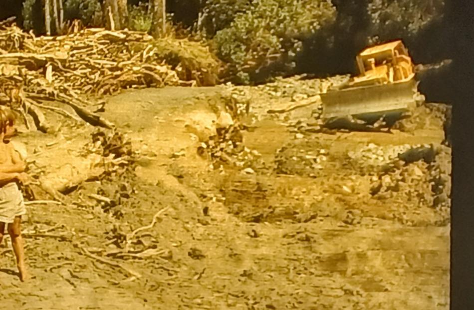 Craig Matheson as a young boy watching the dozer clean up after the Blandswood flooding in 1975....