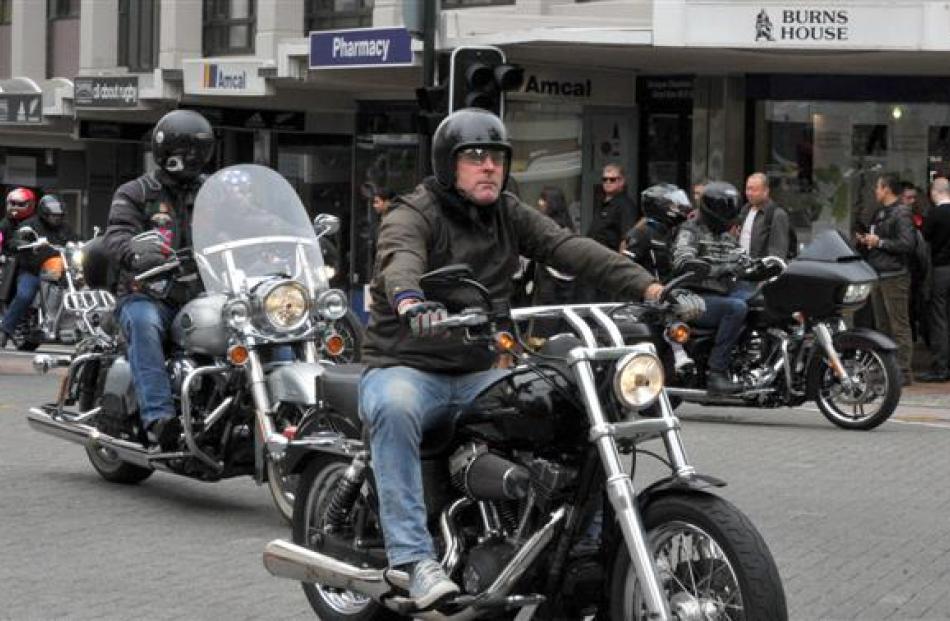 Greg Dunn, of Dunedin, rides his Harley-Davidson Street Bob motorcycle into the Octagon. Photos...