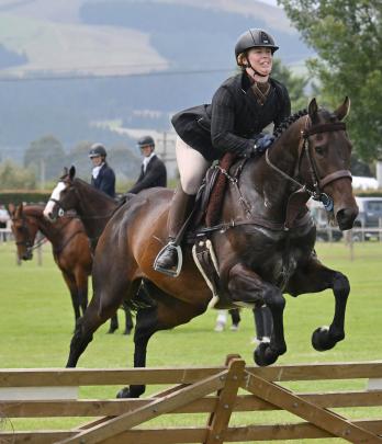 Galloping over a hurdle is Samantha Tasker on her horse, Ballytitan, in the Novice Hunter Class.