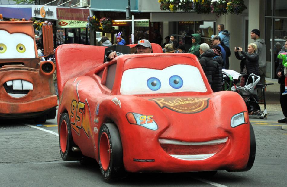 Lightning McQueen leads the Cars floats.