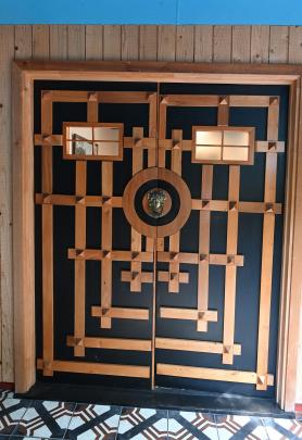 The home has distinctive front doors.