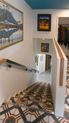 The tiled stairway leads from the entry at street level to the living areas on the middle floor. ...