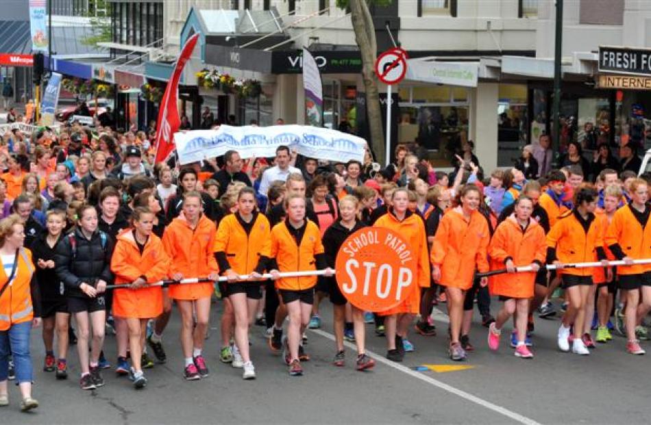More than 300 pupils who marched down George St as part of the annual Dunedin Orange Parade on...