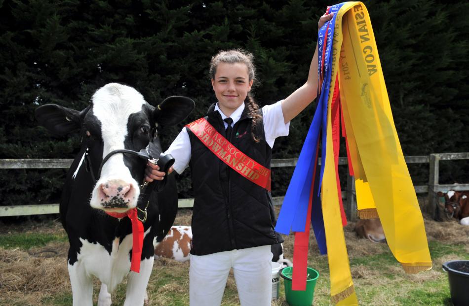 Lorna Button (14) of Port Molyneux, near Kaka Point holds some of the ribbons she was awarded at...