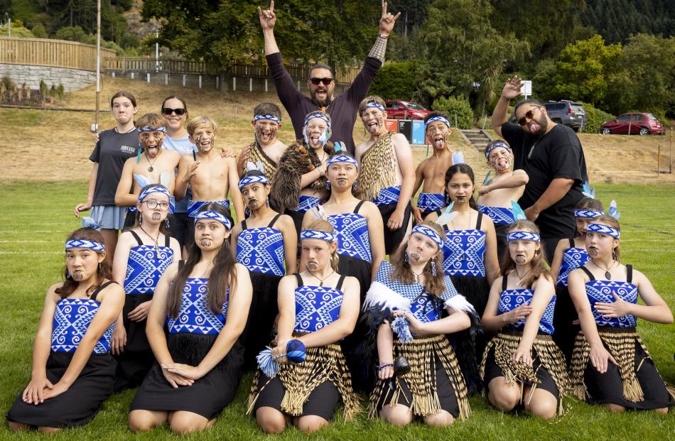 Hollywood actor Jason Momoa (centre back) celebrates with a kapa haka group in Queenstown...