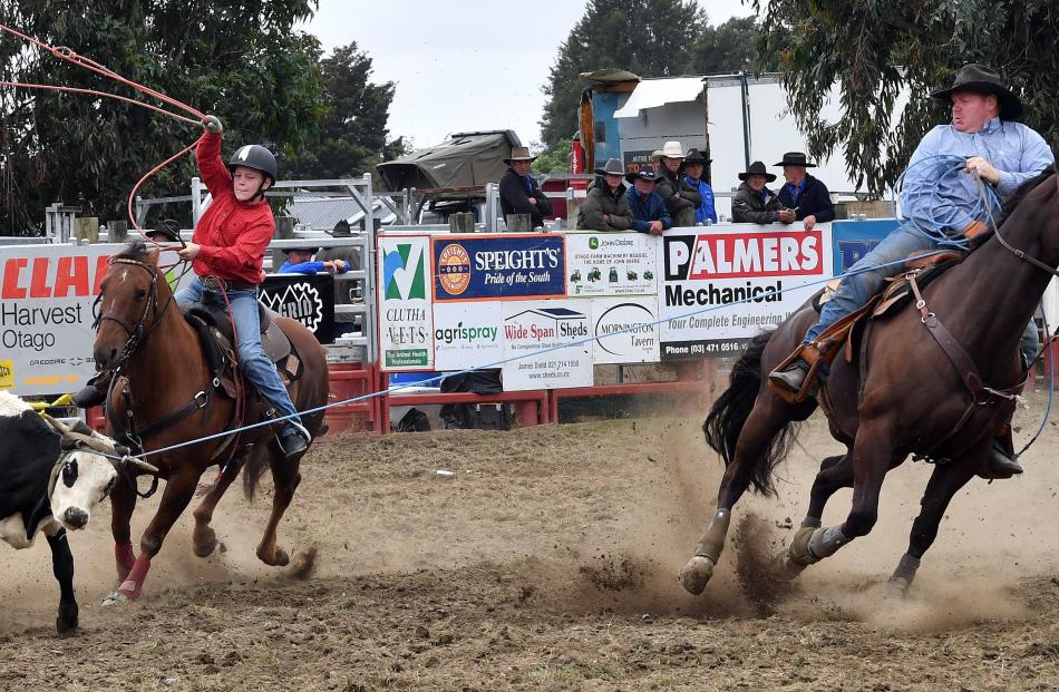 Competing in the open team roping event are Anthony Perkins (left) and Clayton Perkins, both of...