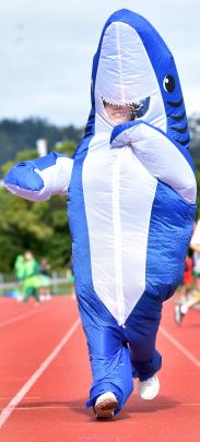Emma Bezett, 13, takes part in the 100m race.