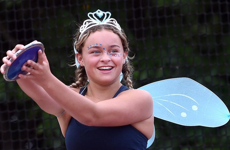 Claudia Shore, 14, tries her hand at discus.