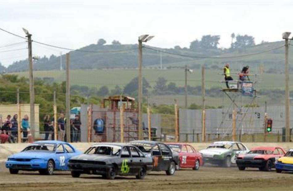 A production saloons race gets off the line during the Christmas race meeting at Beachlands...