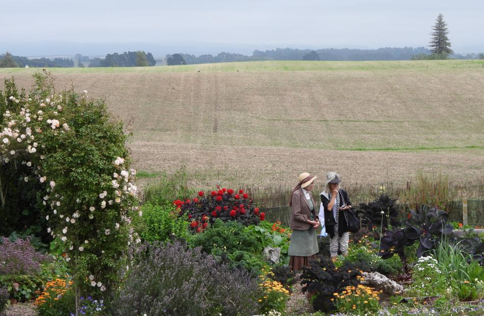 Lamb Day visitors enjoy the traditional garden at Totara Estate amidst the North Otago landscape.