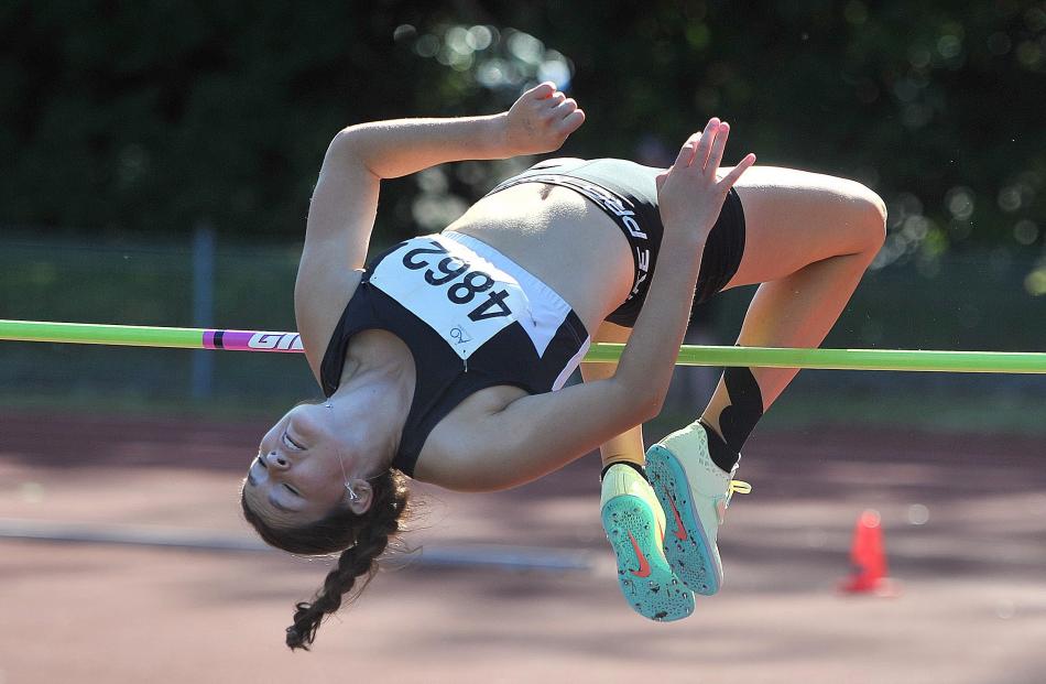 Ava Wiegersma (Athletics Gore) makes it over the bar in the under-18 high jump at the Caledonian.