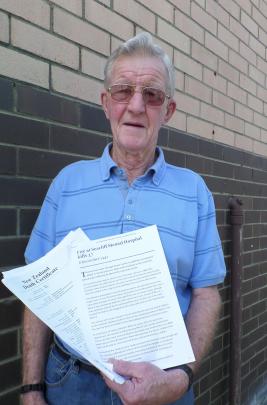 Des Scully, of Perth, with some of the papers that led him to an unmarked mass grave at Dunedin's...