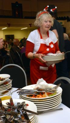 Volunteer Diana Rule is kept busy feeding the multitudes.