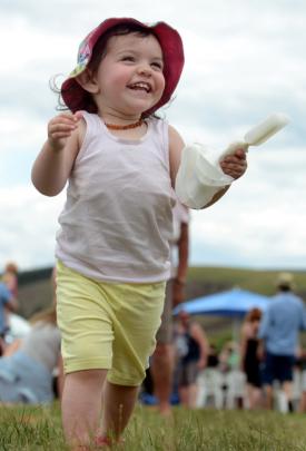 Ashley Johns (1), of Dunedin, enjoys an ice block at Wingatui.