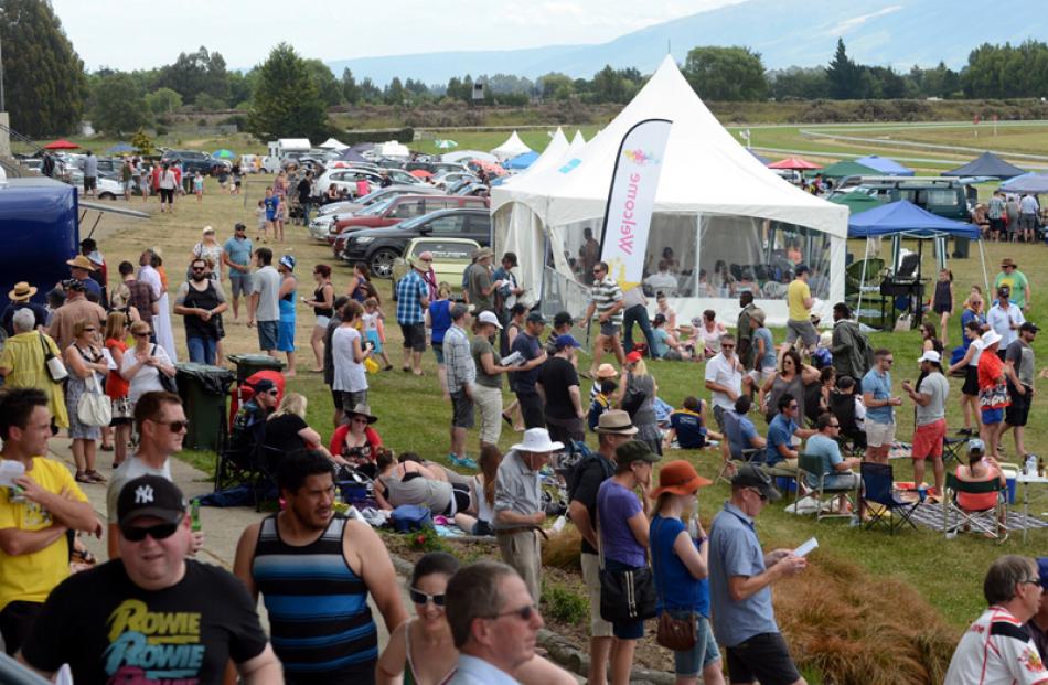 Punters enjoy themselves yesterday.