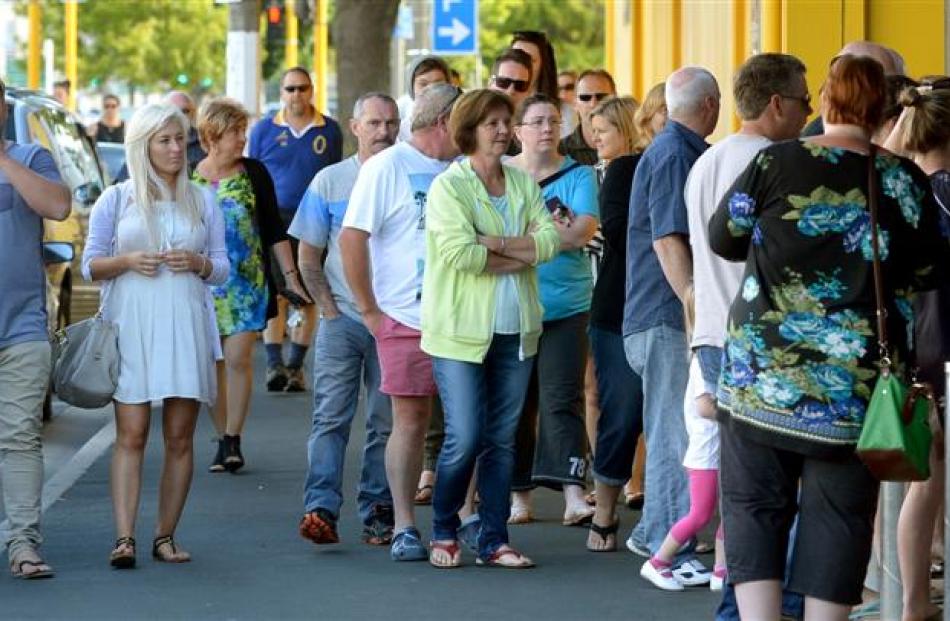 Shoppers queue outside Briscoes to shop for Boxing Day bargains.