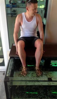 Hamish McNeilly gets the dead skin nibbled off his feet while on holiday in Thailand in November.