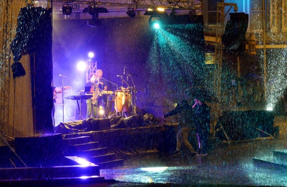 Dancers brave the elements in Dunedin's Octagon. Photo by Gerard O'Brien
