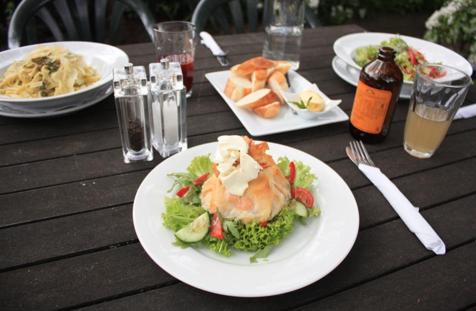 Filo parcel of salmon, leek, and baby peas served on salad.